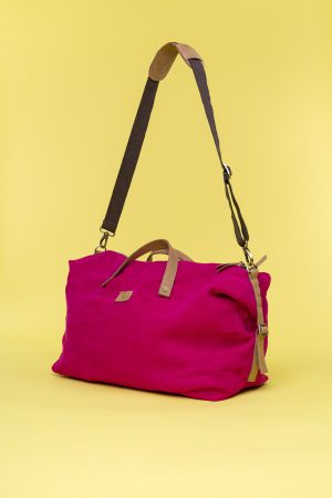 Kwooksta soft jute big weekender bag side view in red with eco leather handles and adjustable cotton shoulder strap