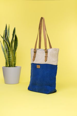 Kwooksta soft jute classic tote side view in blue and natural with adjustable eco leather shoulder straps