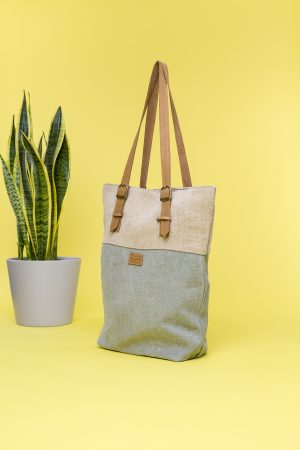 Kwooksta soft jute classic tote side view in sage green and natural with adjustable eco leather shoulder straps