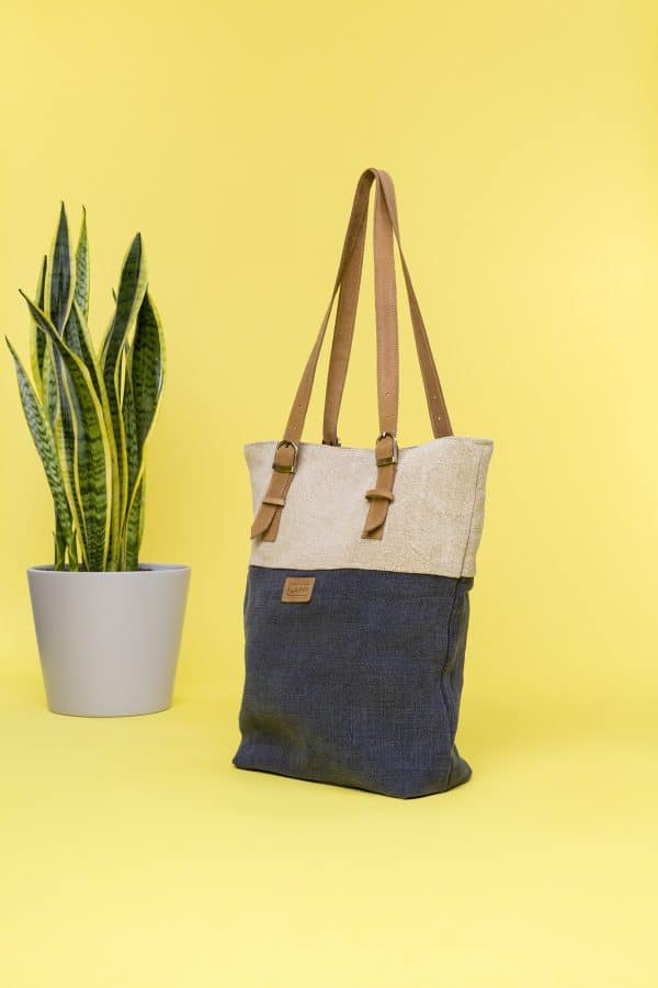Kwooksta soft jute classic tote side view in grey and natural with adjustable eco leather shoulder straps