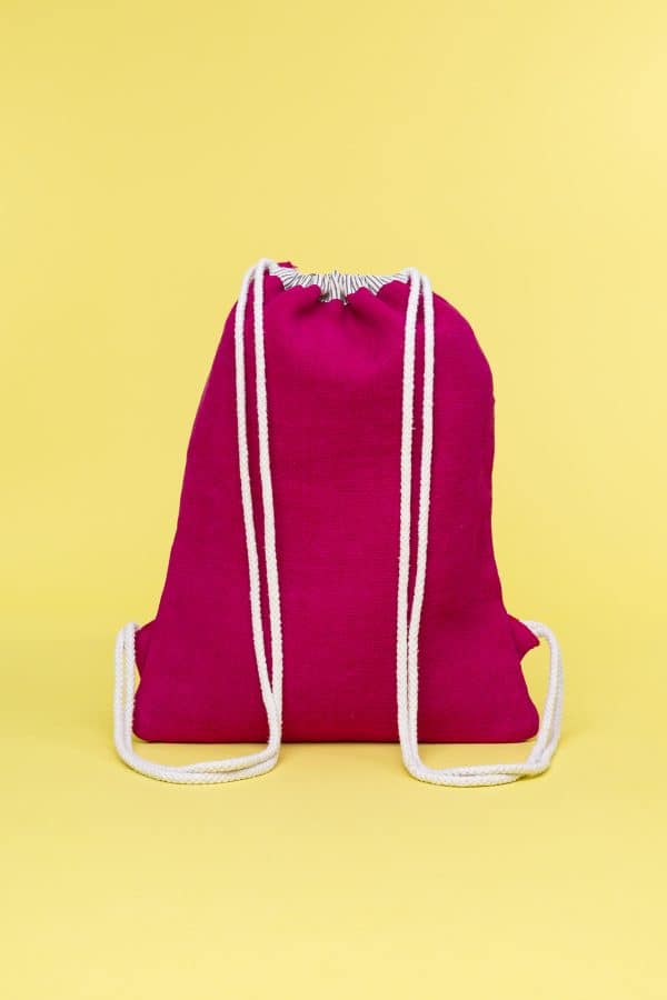 Kwooksta soft jute drawstring bag back view in red and natural with white cotton straps