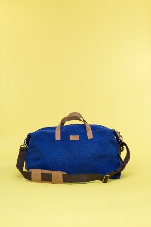 Kwooksta soft jute little weekender bag front view in blue with eco leather handles and adjustable cotton shoulder strap
