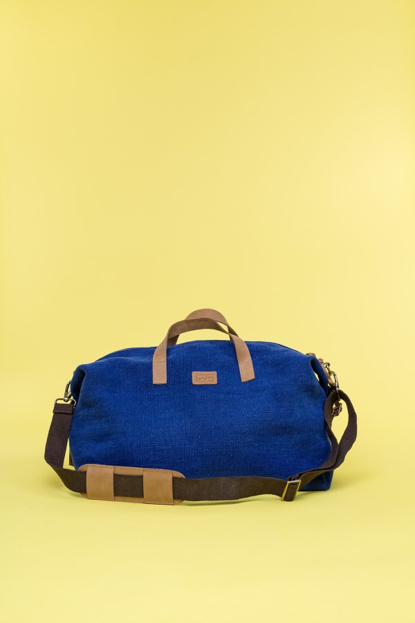 Kwooksta soft jute little weekender bag front view in blue with eco leather handles and adjustable cotton shoulder strap