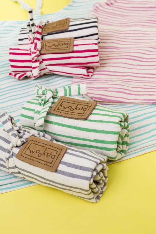 Kwooksta organic cotton reusable shoppers rolled up in black, red, green and grey